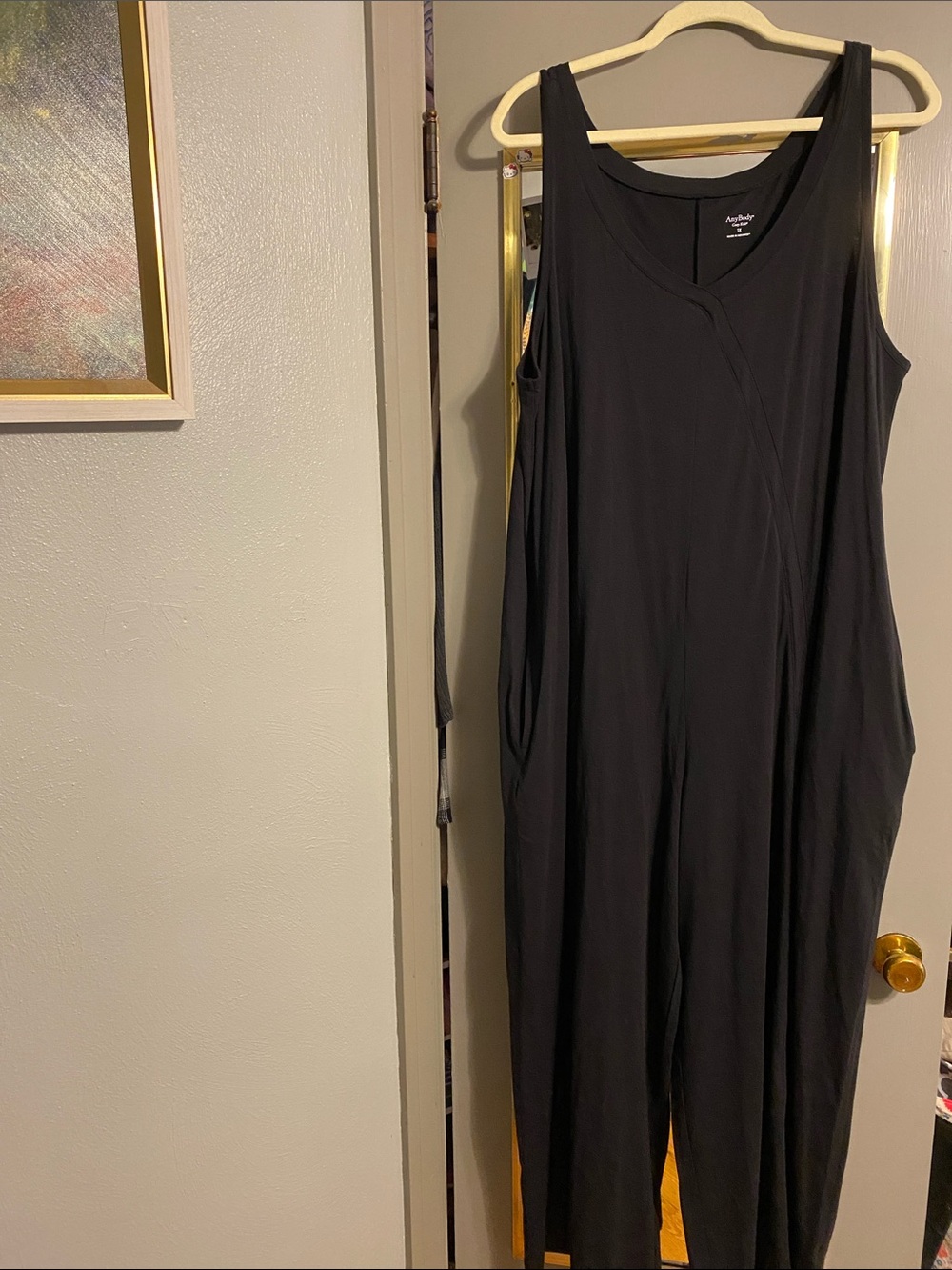 Black SleevelessJumpsuit with Draped Silhouette